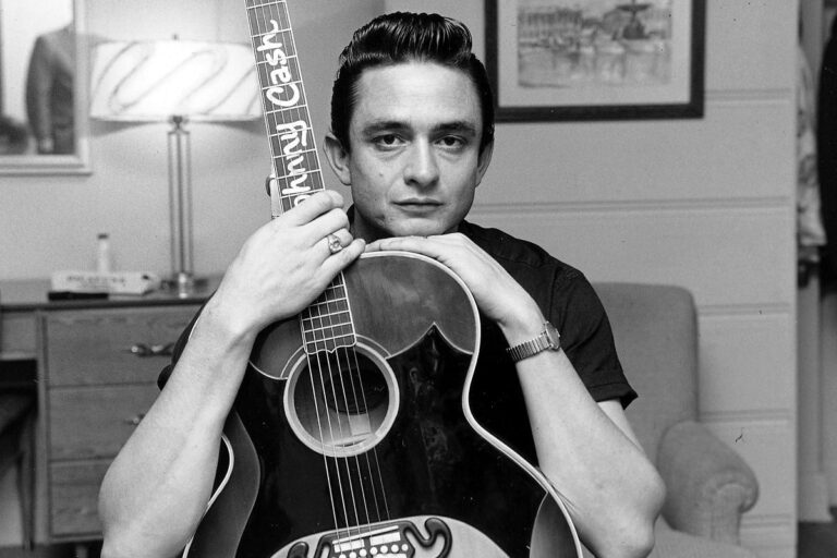 Johnny Cash and a guitar, black and white